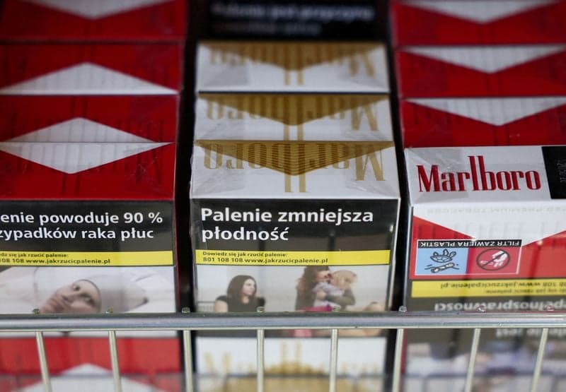 Philip Morris cuts annual profit forecast as currency volatility bites